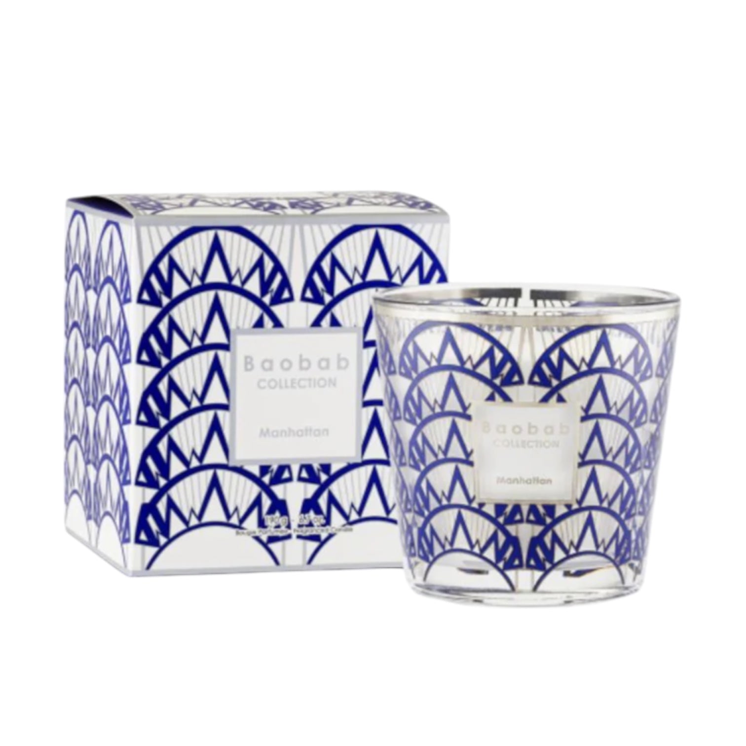 The Baobab Collection Manhattan Body Wellness Collection by Baobab features a fresh-scented candle in a clear glass holder with a blue and white geometric design, displayed next to its matching box.