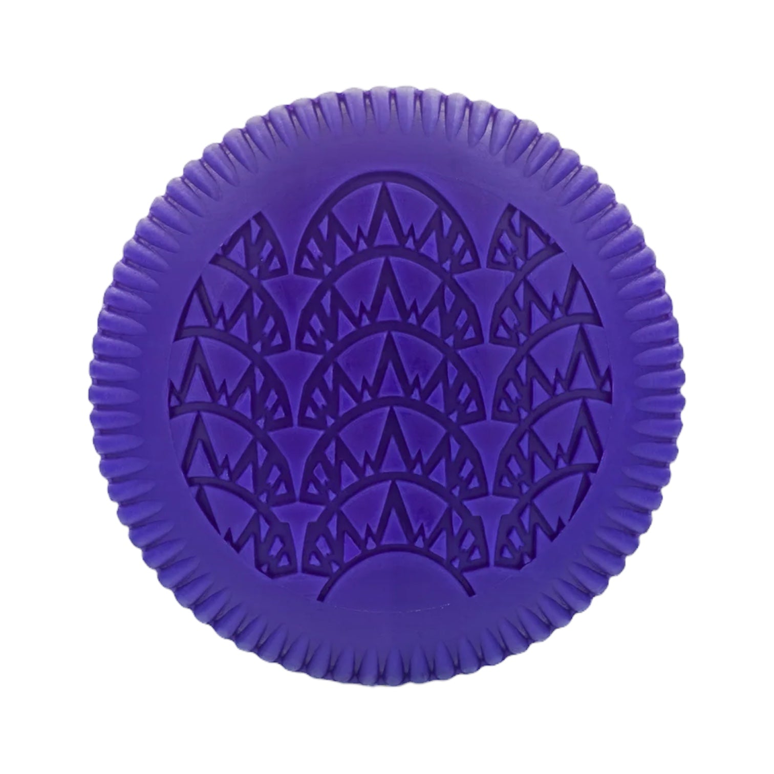 The Baobab Collection Manhattan Body Wellness Collection by Baobab features a round, purple item with a ridged edge and embossed geometric pattern, inspired by the fresh scent of Central Park.