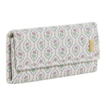 The TRVL Design Luxe Jewelry Wallet features a rectangular shape, pastel floral pattern, fold-over flap, and gold-tone metal label—making it the ideal travel jewelry organizer.