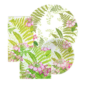 The Caspari Fern Garden Collection features plates and napkins with a green fern and pink flower pattern on white, perfect for stylish, elegant table settings and party supplies.