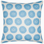 The Aleesa Outdoor Pillow by John Robshaw is a square white pillow with rows of blue circular floral designs. Rain and sun resistant, it's perfect for adding style and durability to your outdoor space.