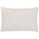 The Chandra Natural Kidney Pillow by John Robshaw features a white linen-cotton cover with an elegant circular floral embroidery, adding a romantic touch to your space.