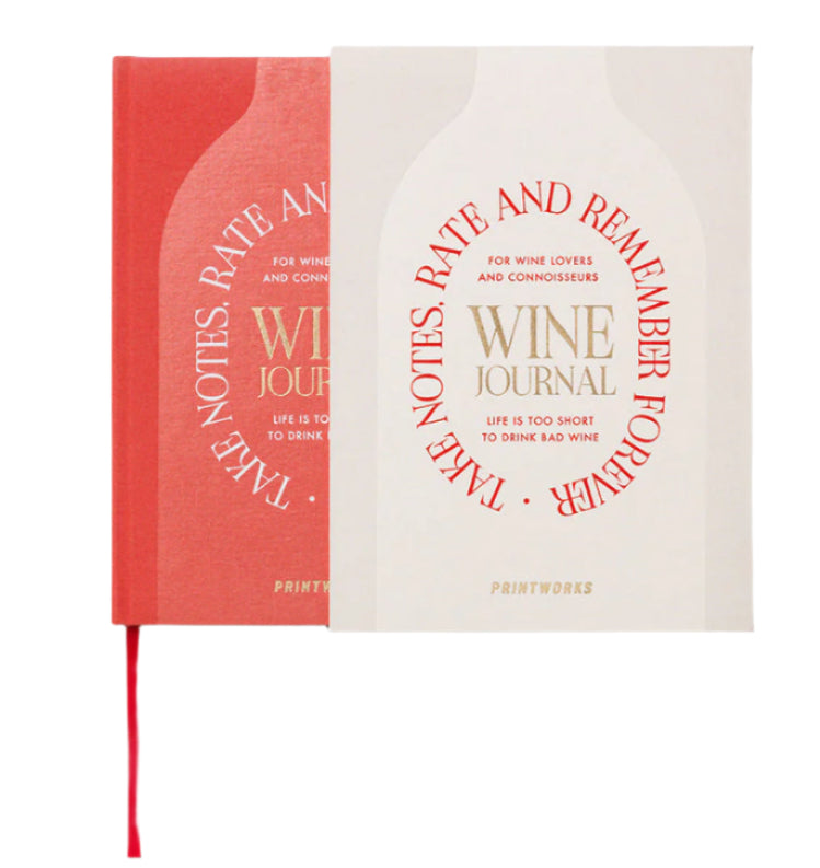 Set of two hardcover PrintWorks Wine Tasting Journals—one red, one cream—with gold “Wine Journal” and “Take Notes, Rate and Remember Forever” text. Ideal for recording wine tasting notes.