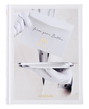 A person in white gloves offers a silver tray with an envelope marked "from your Butler" and "RAFFLES," showcasing British elegance and Asian allure. The book is titled "Raffles" by Assouline.