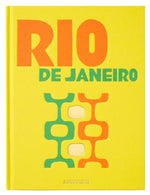The Assouline Rio De Janeiro book features a yellow cover with bold orange and green lettering and abstract geometric shapes, capturing the vivid energy of Carnival.