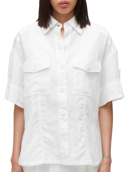 Woman wearing an 3.1 Phillip Lim Oversized Camp Shirt, white poplin button-up shirt.