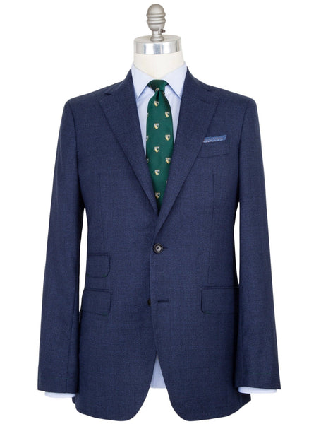 Mannequin displaying a Sid Mashburn Kincaid No. 2 jacket, light blue shirt, and green tie with yellow motifs.