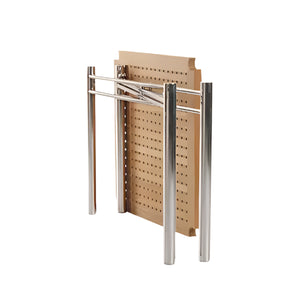 The Sundeck Folding Table by Summit Furniture features a metal frame inspired by campaign furniture, chrome legs, and a perforated rectangular wooden tabletop, shown partially folded.