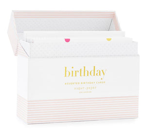 The Sugar Paper Birthday Card Set features assorted birthday cards in a box with a striped bottom and "birthday" gold foil on the front, open to display the vibrant selection inside.
