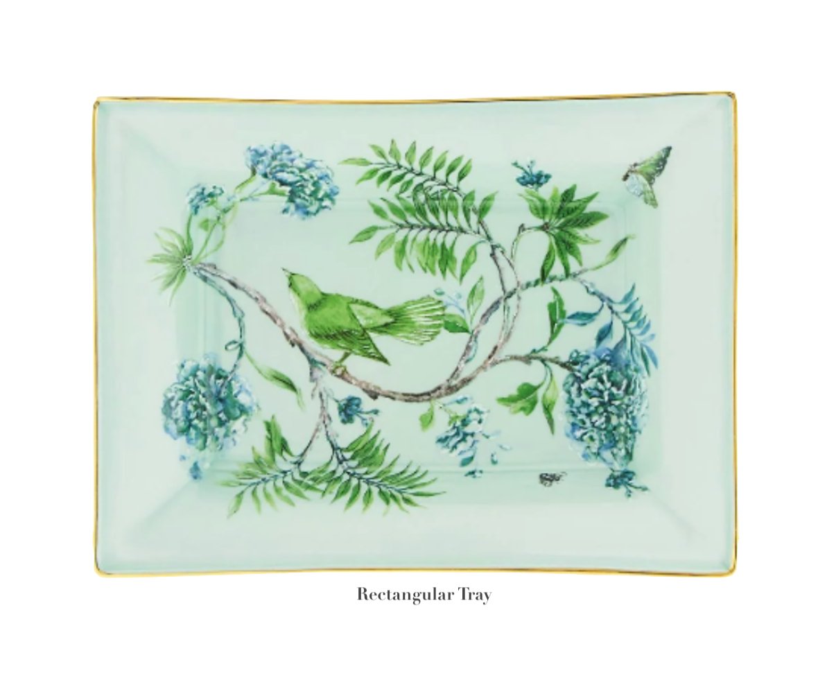 From the Aquazzura Secret Garden Collection by Aquazzura Casa, this rectangular tray features garden-themed botanical illustrations with birds, branches, and flowers set elegantly against a light green background.