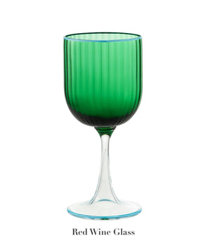 A Murano Striped Green Drinkware Collection red wine glass by Aquazzura Casa, featuring green stripes and a clear stem, is displayed against a white background. "Red Wine Glass" appears below.