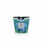 The Baobab Collection Sacred Trees Summer Yarani Candle, with its blue and green tree-patterned glass holder, evokes a baobab forest. It is adorned with the "Baobab Collection" label and a black ribbon, adding elegance to the line.