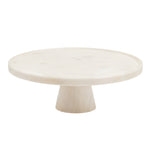 The Blue Pheasant Cake Stand by Blue Pheasant features a round, solid marble top and thick tapered base, elegantly displayed against a white background.