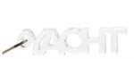The Acrylic Key Chain Collection by Tara Wilson Designs features a transparent "YACHT"-shaped keychain with a metal ring on the letter "Y," combining stylish design with key organization.