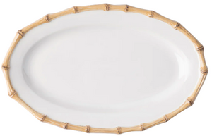 The Juliska Classic Bamboo Medium Platter is an oval white serving piece with a bamboo-style rim—ideal for presenting cuisine at dinner parties.