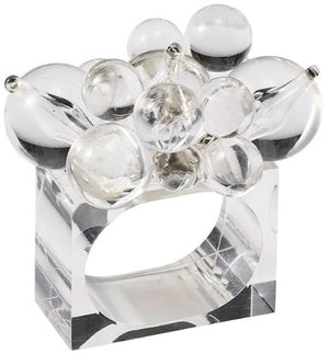 The Kim Seybert Cloud Napkin Ring features a clear Lucite band topped with clusters of rounded and teardrop-shaped acrylic baubles.