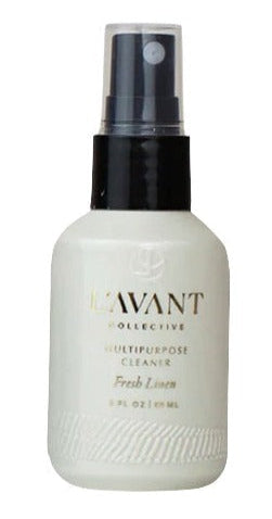 A 3 fl oz mini travel spray bottle labeled "L'Avant Collective Mini Travel Multipurpose Cleaner, Fresh Linen," made with recycled plastic for a powerful clean.