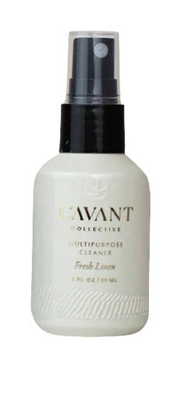 A white bottle of L'Avant Mini Travel Multipurpose Cleaner with a black cap designed to remove grease and grime from surfaces.
