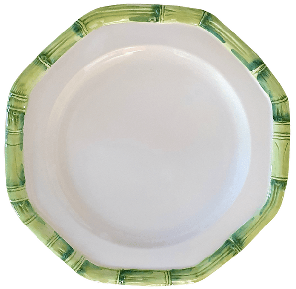 An empty octagonal plate with a white center and green bamboo patterned edges showcases the Italian craftsmanship of Les Ottomans Green Ceramic Bamboo.