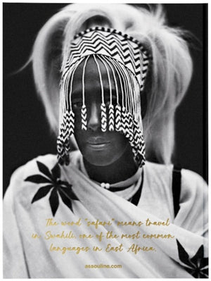 A monochrome portrait of a person with a beaded headdress and a traditional garment, with a caption explaining the meaning of 'safari' in Swahili and its connection to African Adventures: The Greatest Safari on Earth by Assouline.