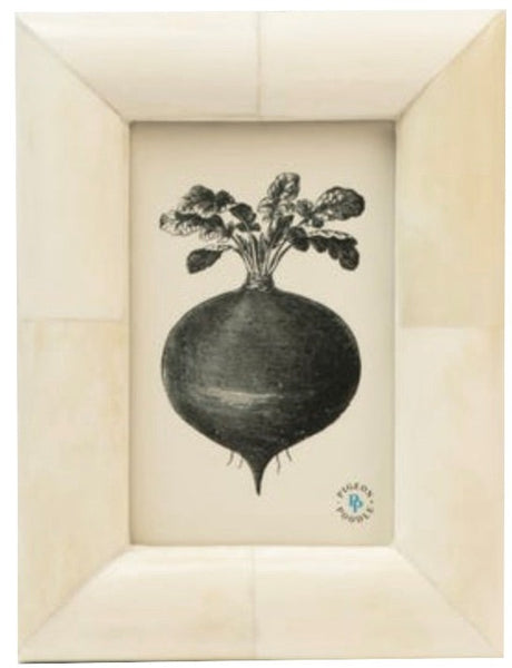 Black and white illustration of a radish with leaves, centered on a beige background, framed in a Pigeon & Poodle Vannes Frame Collection frame, with a small blue logo at the bottom.