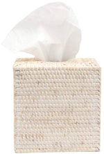 The Dalton Bath Collection by Pigeon & Poodle features a woven rattan tissue box holder with expert craftsmanship, shown with a white tissue partially pulled out.