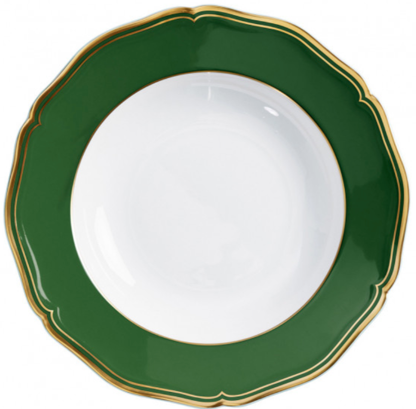 A round Raynaud Mazurka Or Fond Vert porcelain plate with a wide, hand-painted green and gold rim and white center, shown from above against a white background.