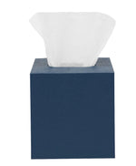 The Dannes Bath Collection by Pigeon & Poodle features a navy blue tissue box in faux waxed Belgian linen, topped with a single white tissue—an elegant accent for any monochrome bath triple threat setup.