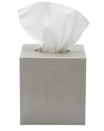 The Dannes Bath Collection tissue box by Pigeon & Poodle in grey faux waxed Belgian linen, with a single white tissue peeking from the top, offers a chic monochrome accent for any space.