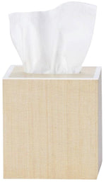 A tissue box from Pigeon & Poodle’s Maranello Bath Collection features a light wood texture with a white tissue partially visible at the top.