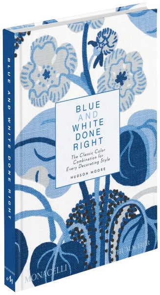 A hardback book titled "Blue and White Done Right" by Phaidon, featuring a blue and white floral design on its cover.