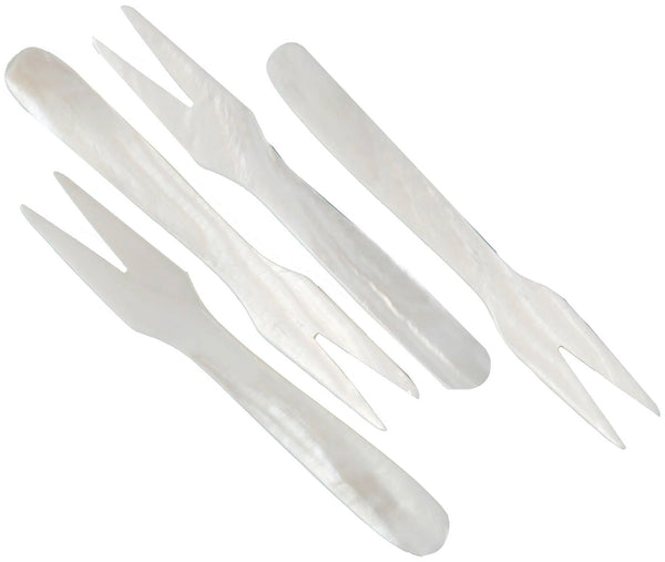 Set of Be Home Seashell Forks including a knife, fork, and two spoons isolated on a white background.
