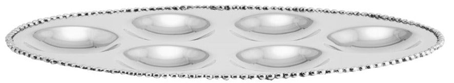 The Michael Aram Molten 6 Seder Plate features six round indentations and a beaded edge, blending contemporary design with timeless function for holding eggs or appetizers.