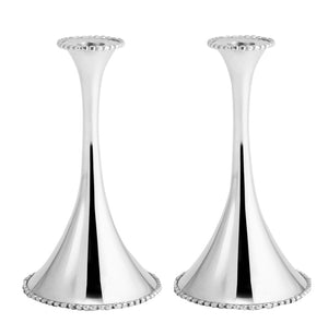 The Michael Aram Molten Candleholders feature polished silver, flared bases, and beaded edging—melding modern style with timeless craftsmanship, showcased against a white background.