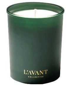 The Candle Winter Fir Green by L’Avant Collective is a green glass holder with a white candle, gold front label, and cozy natural scents to bring hygge vibes to your space.