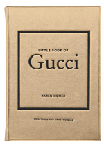 The cover of the "Little Book of Gucci" by Karen Homer, produced by Graphic Image, boasts a gold background with black text, beautifully encapsulating Gucci's opulent fashion heritage and Italian elegance.