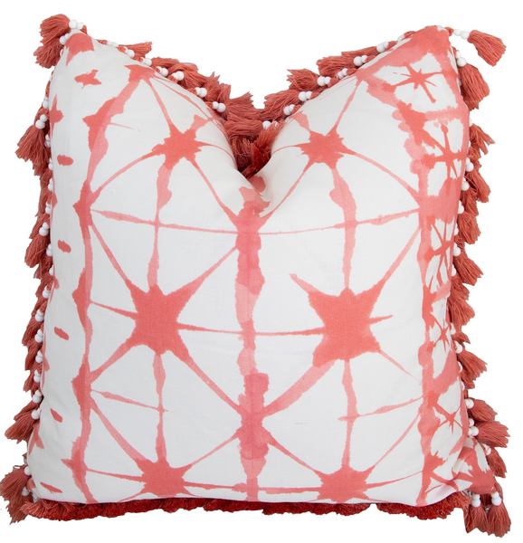 Decorative double-sided Futuna Corail Pillow with a red and white geometric pattern and tassel corners by Associated Design.