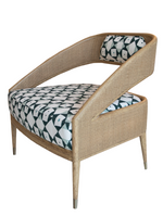 A Tenan Lounge Chair in Broadway by McGuire Furniture, a modern wooden armchair with a geometric-patterned cushion and backrest in black and white, available exclusively at Pure by Hive in West Palm Beach.