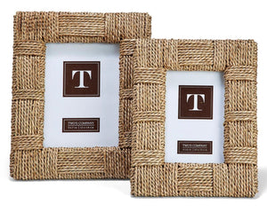 The Sea Grass Frame Collection by Two's Company features two rectangular frames crafted from braided sea grass rope—one large, one small—each showcasing a sample insert with a capital "T" and "Two's Company" text.