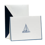 The Crane Sailboat Card Set features folded notecards with a simple blue engraved sailboat illustration and matching envelopes lined in dark blue—ideal for fans of luxury stationery.