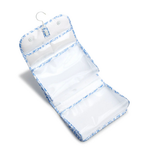 The TRVL Design Luxe Gloss All Heart Blue Travel Set features blue and white trim, three clear zippered compartments, and a hanging hook—perfect for your travel accessories collection.