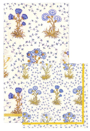 The Semis de Fleurs Blue Collection by Caspari features rectangular and square napkins with blue and gold floral patterns, small blue vines on white, plus a square option with a yellow border.