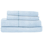The Cinde Light Indigo Bedding Collection by John Robshaw features cotton percale sheets with a blue and white repeating leaf pattern, neatly folded and stacked.