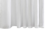 The Matouk Shower Curtain Liner features a white fabric with gentle folds, a slightly wavy hem at the bottom, and a water-repellent finish.