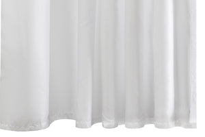 The Matouk Shower Curtain Liner features a white fabric with gentle folds, a slightly wavy hem at the bottom, and a water-repellent finish.