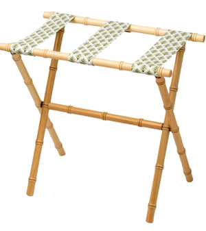 The Sorella Glenn Maple Luggage Rack, Highlands Pine, features three sturdy fabric straps with a green leaf pattern—perfect for stylish suitcase storage.