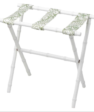 The Sorella Glenn White Luggage Rack, Fern Moss, features maple hardwood construction and green-patterned fabric straps for convenient suitcase storage.