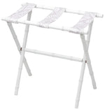 The Sorella Glenn White Luggage Rack, Fern Lavender, features three fabric straps and foldable legs in a bamboo-inspired design crafted from durable maple hardwood. Made in the USA.