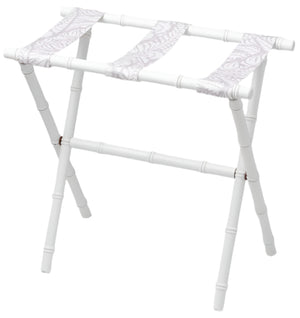The Sorella Glenn White Luggage Rack, Fern Lavender, features three fabric straps and foldable legs in a bamboo-inspired design crafted from durable maple hardwood. Made in the USA.