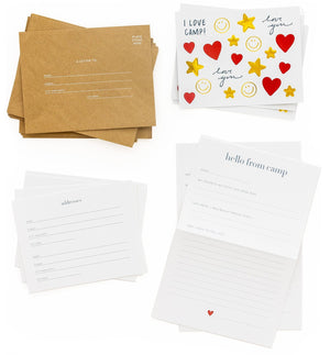 The Sugar Paper Camp Notes Box includes four sets of camp-themed stationery—with brown envelopes, “I love camp!” cards, address cards, and “hello from camp” letter sheets—arranged on white for your next adventure.